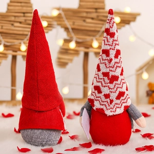 Romantic Valentine's Day couple gnomes with heart patterns and red knit hats for home decor