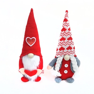 Set of Valentine's Gnomes with knitted hats and plush hearts for festive shelf decoration