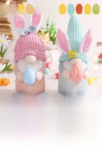 Detail of plush Easter gnomes with rabbit ears holding colorful polka dot eggs