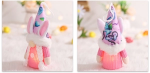Close-up of pink Easter gnome with bunny ears and warm glowing LED lights