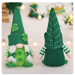Close-up of green St. Patrick's Day gnomes with shamrock patches and knit hat details