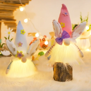 Lighted Easter bunny gnomes with pink floral ears and plush bodies for home decor