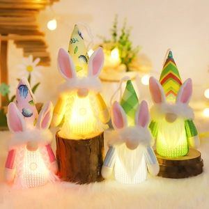 Set of four lighted Easter gnomes with rabbit ears in macaron colors for home decor