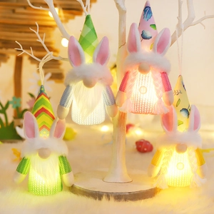 Set of four glowing Easter gnomes with bunny ears and warm LED lights for home decoration