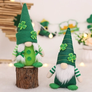 Pair of St. Patrick's Day gnomes with green shamrocks and white beards on wood base