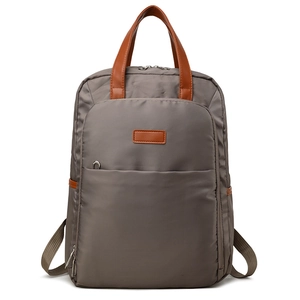 Minimalist grey large capacity laptop backpack with brown leather accents and side pockets