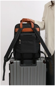 Detail of laptop backpack with luggage strap and hidden anti-theft back pocket