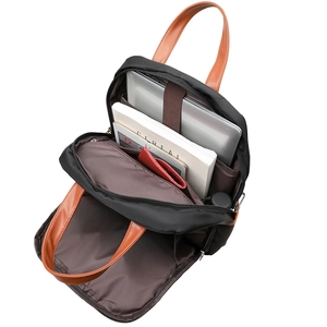 Detail of laptop compartment and inner pockets in a black nylon commuter backpack