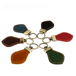 Detail of vintage leather car keychains with hand-stitched edges in multiple colors
