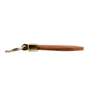 Close-up of vintage brown leather keychain with sturdy stitching and aged brass metal ring