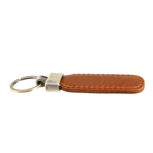 Close-up of vintage brown leather keychain with hand-stitched edges and metal ring