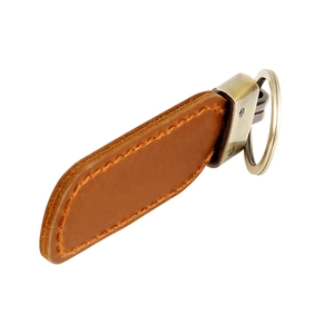 Detail view of brown vintage crazy horse leather keychain with brass metal ring and beige stitching