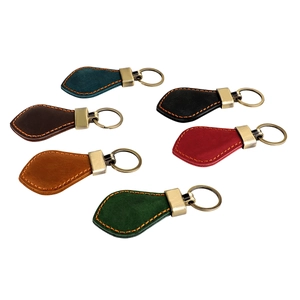 Set of six vintage crazy horse leather car keychains in assorted colors with metal rings