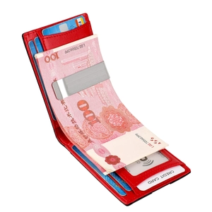 Slim red leather RFID wallet with silver money clip and card slots on white background
