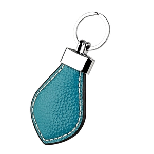 Macro detail of teal lychee grain leather keychain with white contrast stitching