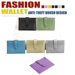 Detail view of RFID blocking leather card holders with lychee texture and snap closure