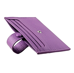 Detail of purple litchi leather card holder featuring tiered slots and secure snap closure