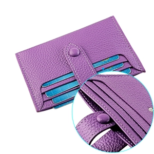 Detail of purple litchi grain leather card holder with multiple slots and metal snap
