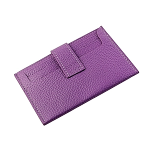 Detail view of purple lychee grain leather card holder with contrast stitching and multi slots