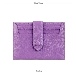 Detail of purple litchi grain leather card holder with secure snap button and white stitching