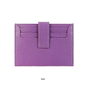Detail view of purple pebbled leather card holder showing white stitching and back slots