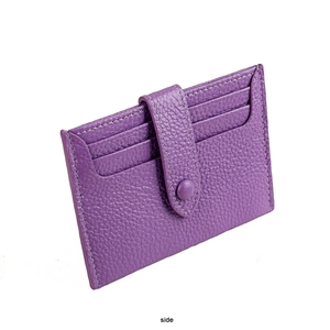 Close-up of purple pebble leather RFID card holder with side slots and snap fastener