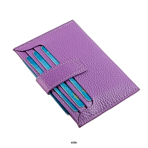 Detailed view of purple leather card holder with multiple slots and white stitching