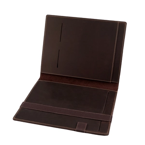 Detail view of dark brown leather A5 notebook cover showing card slots and pen holder