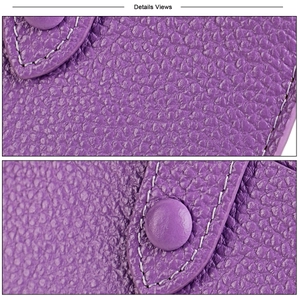 Macro detail of purple pebble grain leather card holder with contrast stitching and clasp
