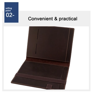 Detail of dark brown leather notebook cover showing card slots and elastic strap