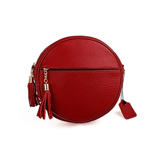 Red circular crossbody bag in litchi grain cowhide leather with stylish fringe tassels