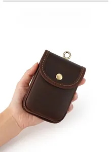 Macro detail of crazy horse leather waist pouch with vintage metal clasp and snap closure