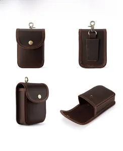 Macro detail of crazy horse leather waist pouch with metal hook and belt loop