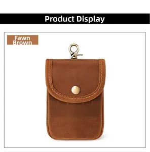 Detailed view of crazy horse leather waist pouch with brass hook and snap closure