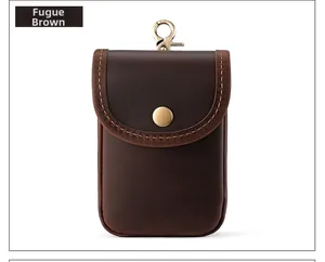 Detail of crazy horse leather waist bag with brass button and metal spring hook