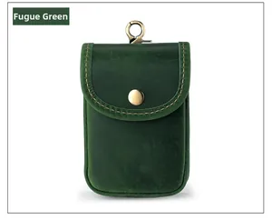 Close-up of crazy horse leather waist bag in green with vintage texture and brass clasp
