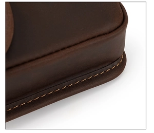 Macro shot of precise stitching and premium brown leather texture on men's vintage waist bag