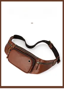 Macro shot of dark brown pebbled leather texture and bronze zippers on a men's waist bag