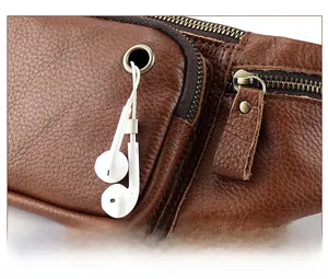Detail view of genuine leather bag with brass zipper and functional earphone hole design