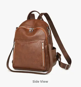 Detailansicht eines braunen Vintage-Rucksacks aus weichem Leder mit silbernen Zippern