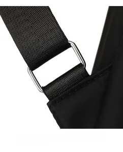 Close-up of black nylon shoulder strap with durable silver metal rectangle connector