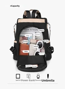 Large capacity black nylon backpack showing main compartment with iPad and A4 magazine storage