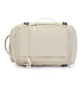 Detail of water-resistant beige travel backpack with functional zippers and buckles