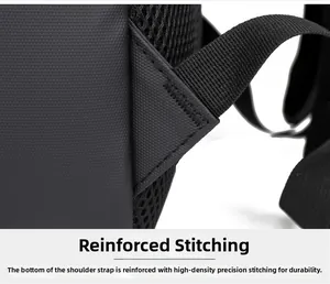 Macro detail of reinforced triangular stitching and durable mesh on a black business backpack