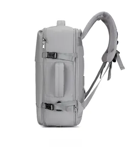 Side view of gray travel backpack with adjustable side buckles and reinforced handle