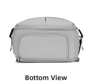 Detailed bottom view of travel backpack featuring multi-zippered compartments and durable fabric