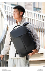 Close-up of business travel backpack showing durable textured fabric and side handle