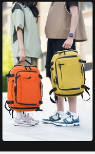 Outdoor waterproof travel backpack in orange and yellow with multi-pocket storage system