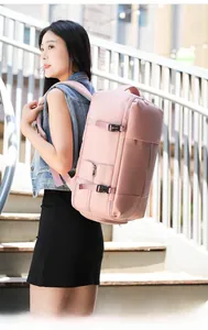 Pink large capacity travel backpack with side compression straps and multiple zip pockets