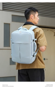 Detail view of water-resistant business travel backpack with side buckle on male model